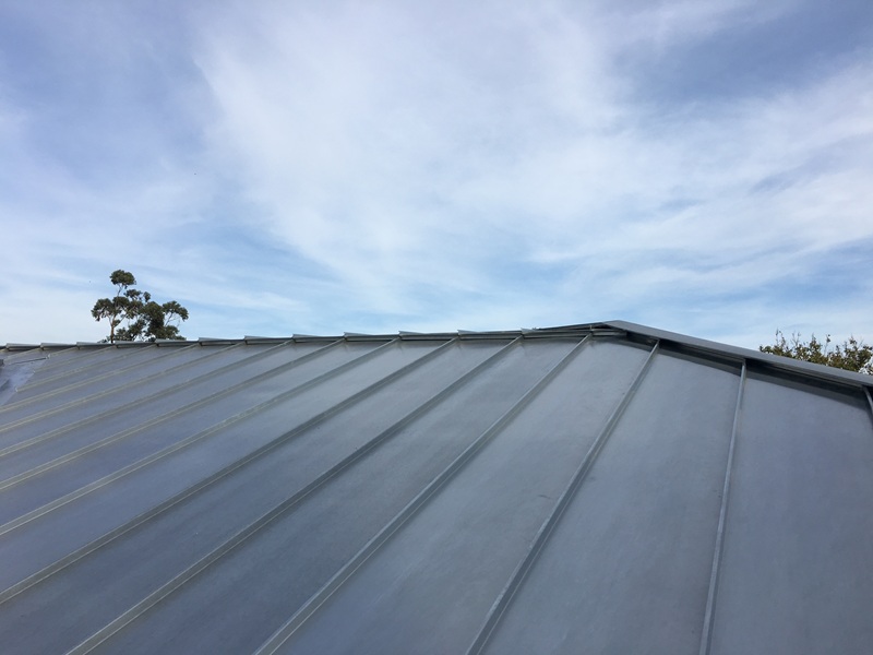 Why does the NCC now require ventilated roof spaces under metal roofing?